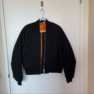 Black bomber jacket with orange lining